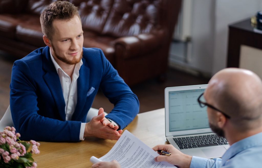 Confident man attending job interview