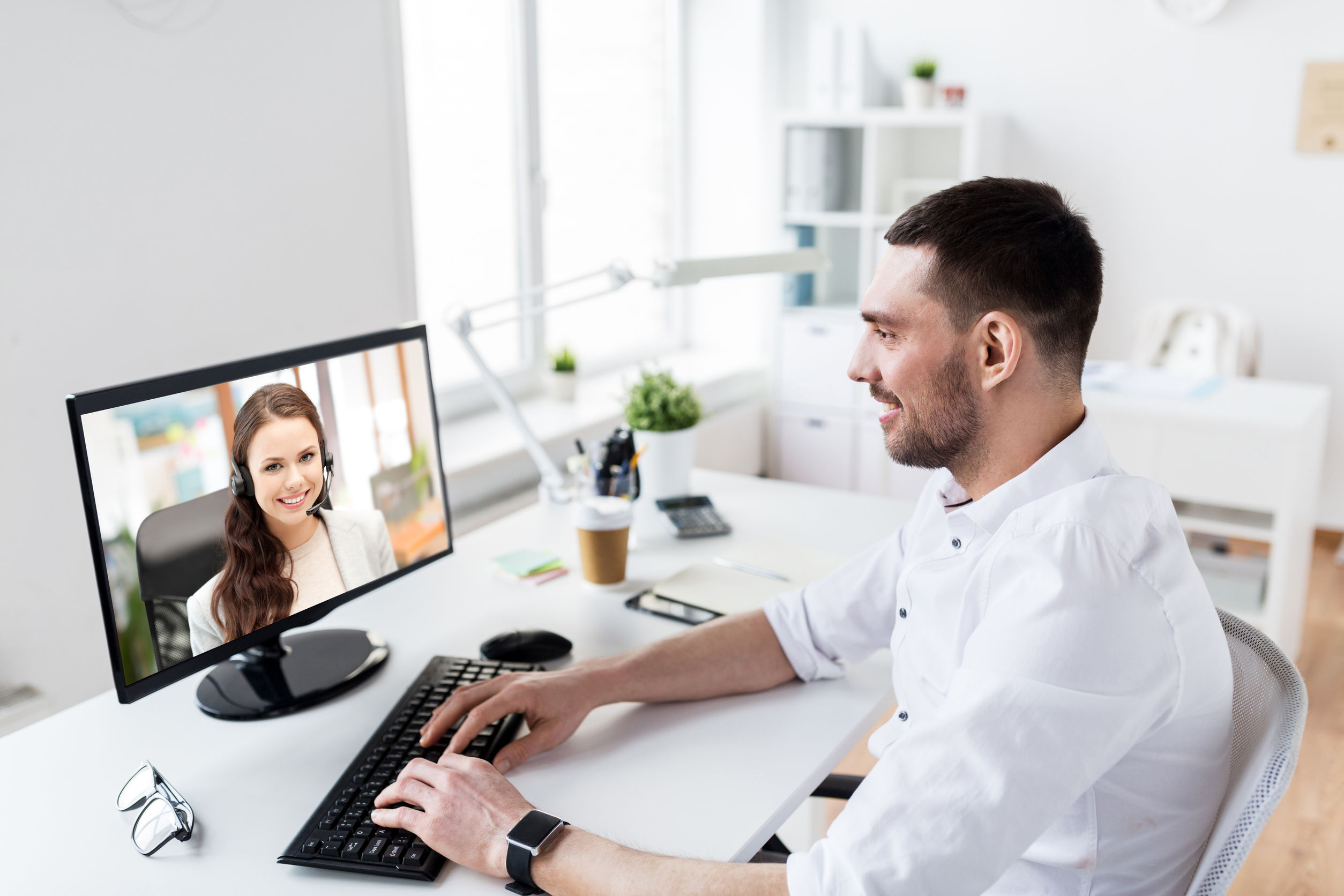 businessman having video call on pc at office
