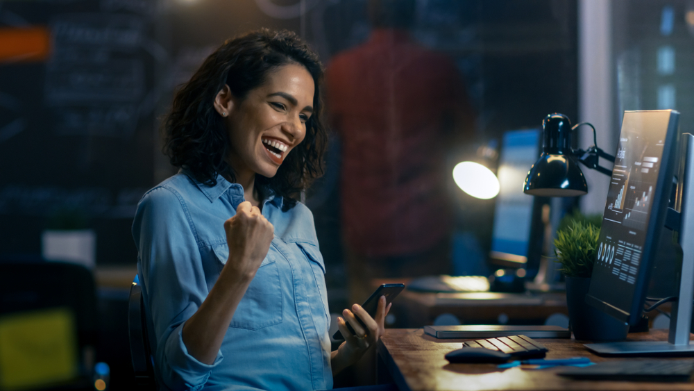 Woman excited at desk