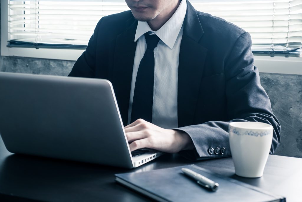 Close up of Businessman working on the office desk.